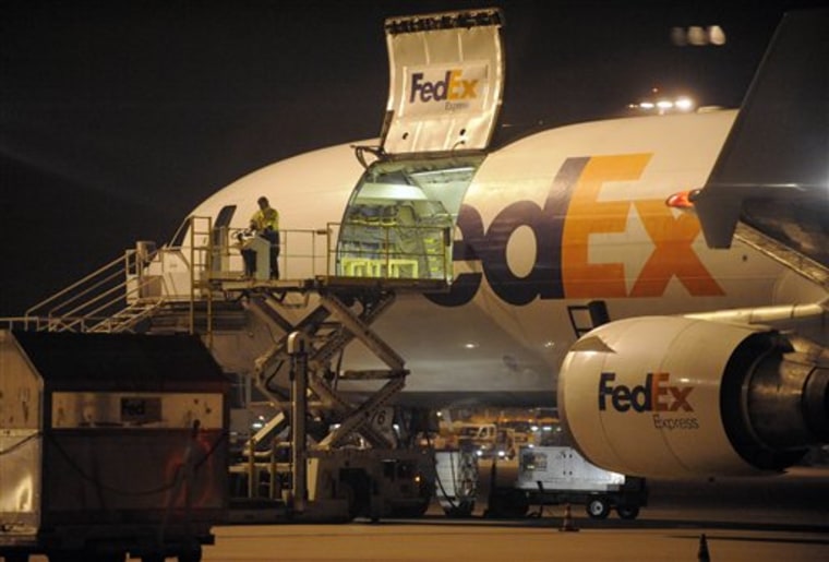 A cargo plane is loaded at the FedEx distribution center at the International Cargo Airport in Cologne, western Germany on Monday. Investigators found out that packages that terrorists in Yemen attempted to smuggle onto an aircraft were moved through Cologne.